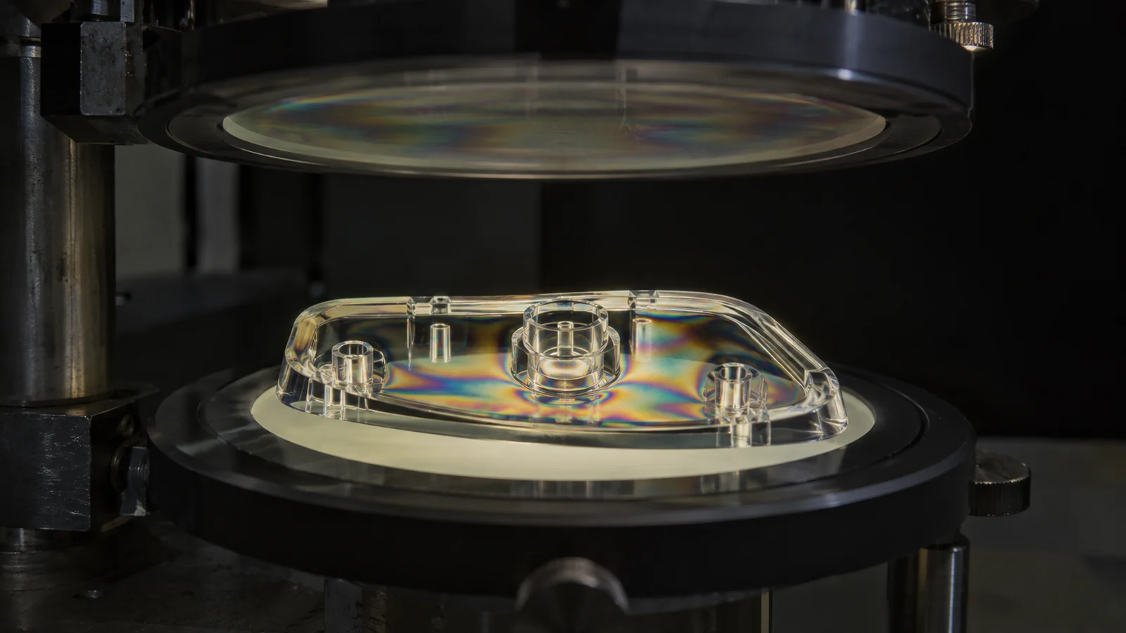 molded-optic-between-crossed-polarizers